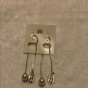 Gold and White Dangle Earrings with Textured Pendants